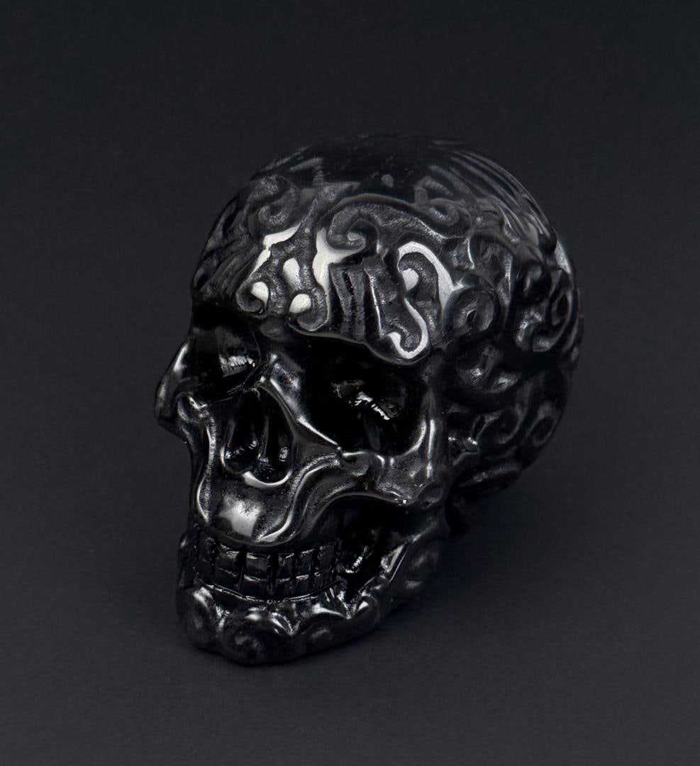 Obsidian Skull Carving: 3 1/8" by 2 1/4" by 2". 325 grams.