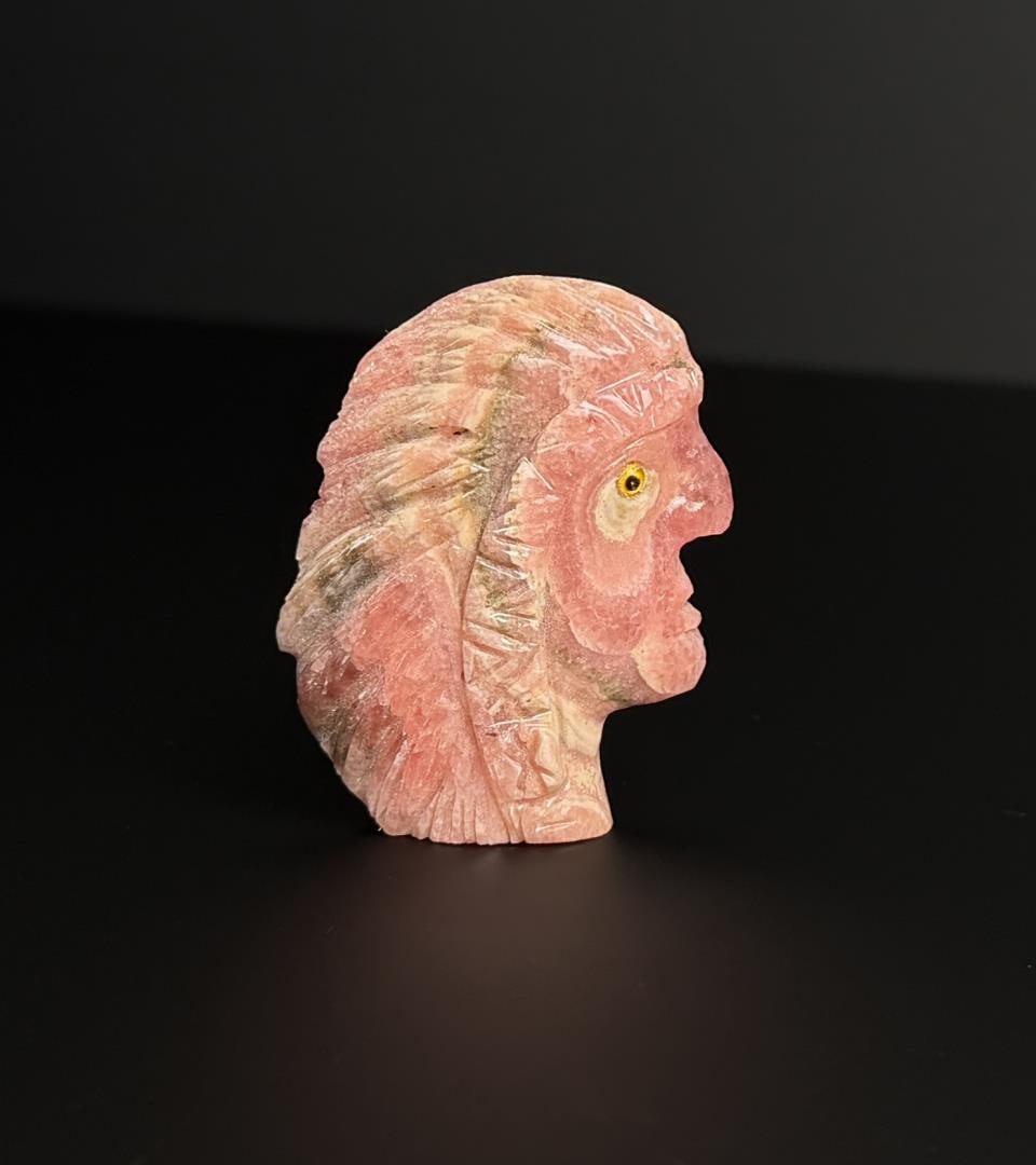 Rhodochrosite Indian Chief Head Carving: 2" by 1 1/2" by 1/4". 38.95 grams.