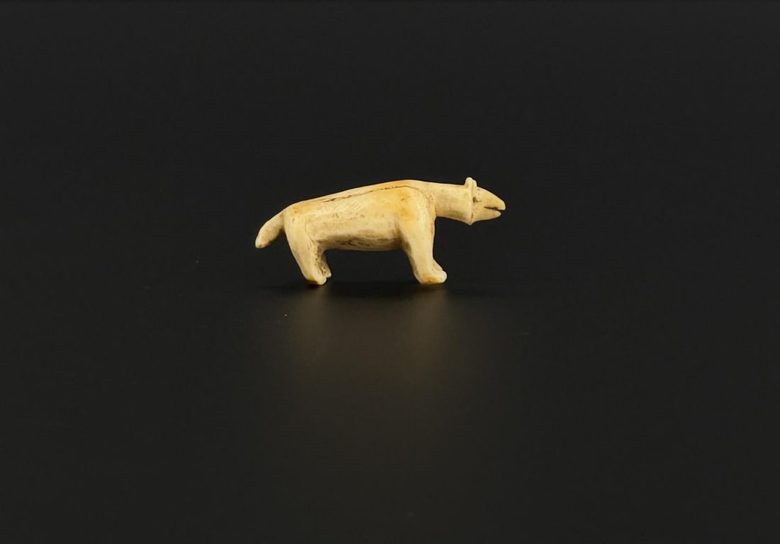 Ancient Thule Inuit Alaskan Eskimo Carved Bear: 1 1/8" by 1/2" by 1/4". Native made prior to 1972. This item cannot be shipped to Oregon, California, Hawaii, New York, New Jersey, Internationally, or any other state that prohibits.