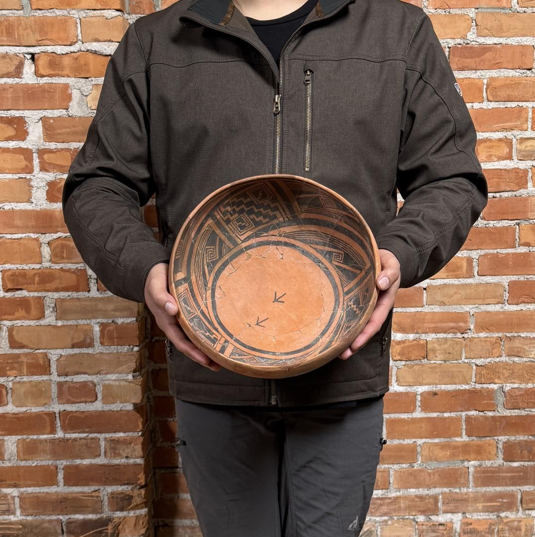 Ancient Anasazi St. Johns Pottery Bird Track Bowl: 11 5/8" by 11 1/2" by 5 1/4". Has been reassembled as is expected. Provenance: Fred Harman Art Museum, Estate of N. Harman