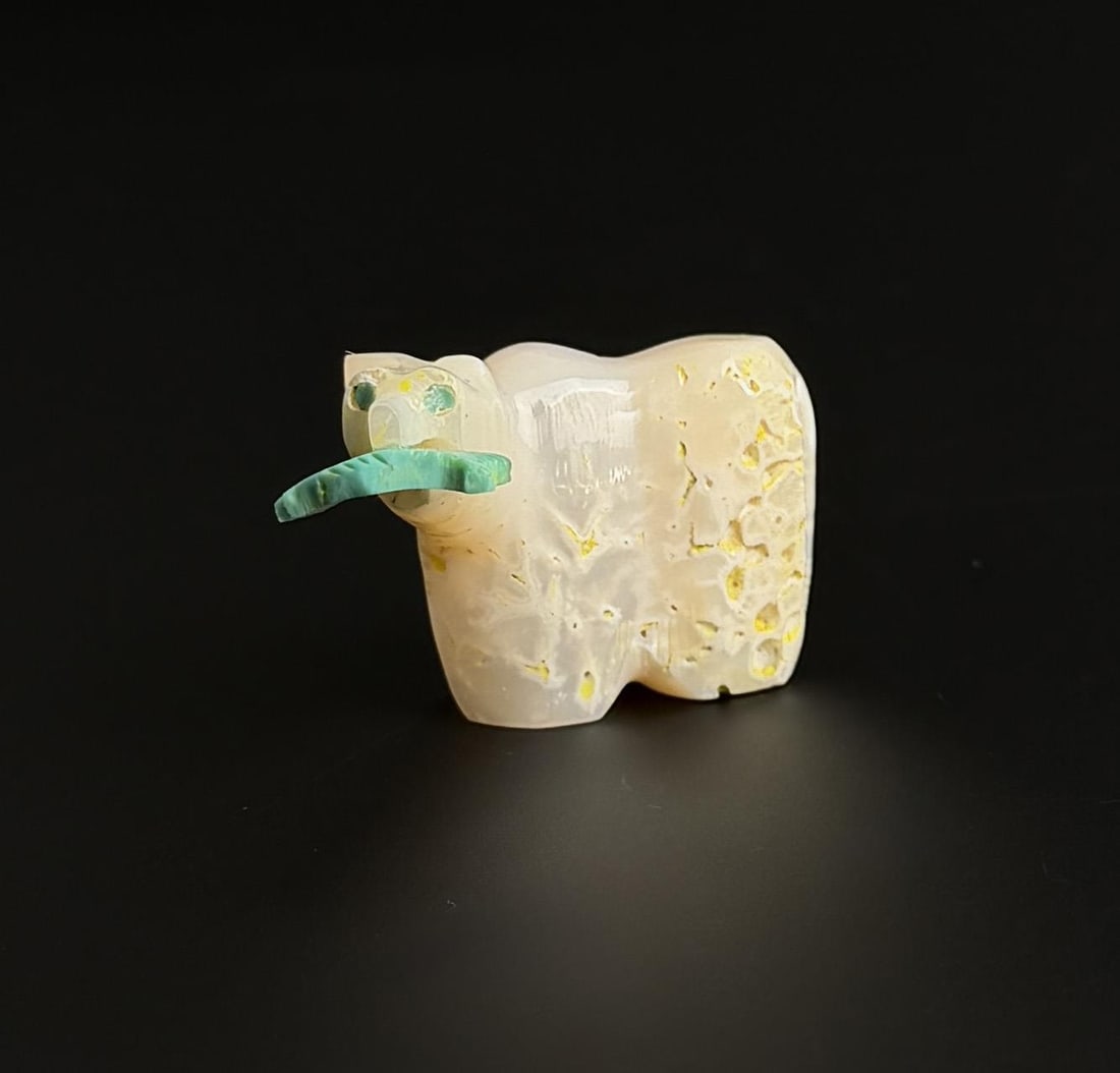 Zuni Carved Mother of Pearl Bear Fetish: 1 1/2" long, 3/4" tall.