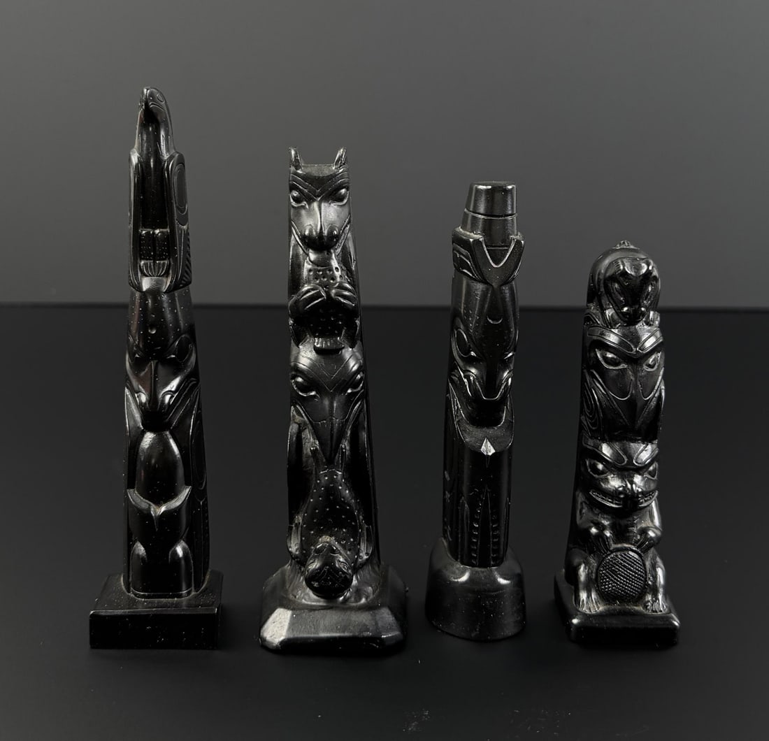 Collection of Northwest Coast Resin Totem Poles: Nice grouping.