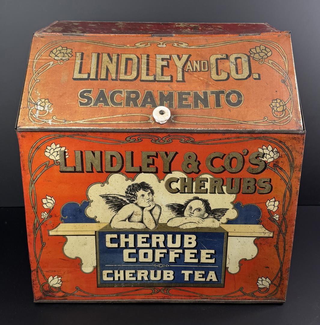 Lindley & Co. California Cherub Coffee Tin Bin: This is the only known example of this rare and graphic country store bin. 19 5/8" by 19 1/2" by 14 1/4".
