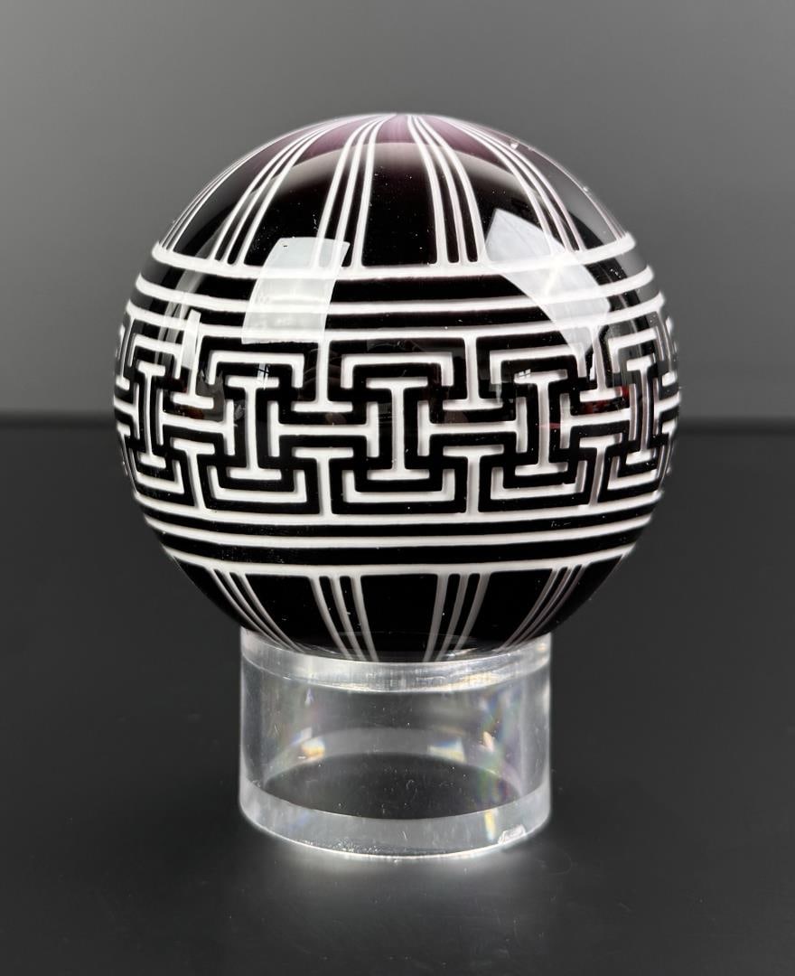 Mark Matthews Pompeii Art Glass Marble: 2 15/16" diameter. Signed and dated Matthews 2005. Black and White Graal Sphere. A few small bruises as shown. Mark Matthews is notably recognized for his work in glass, especially in glass spheres. W