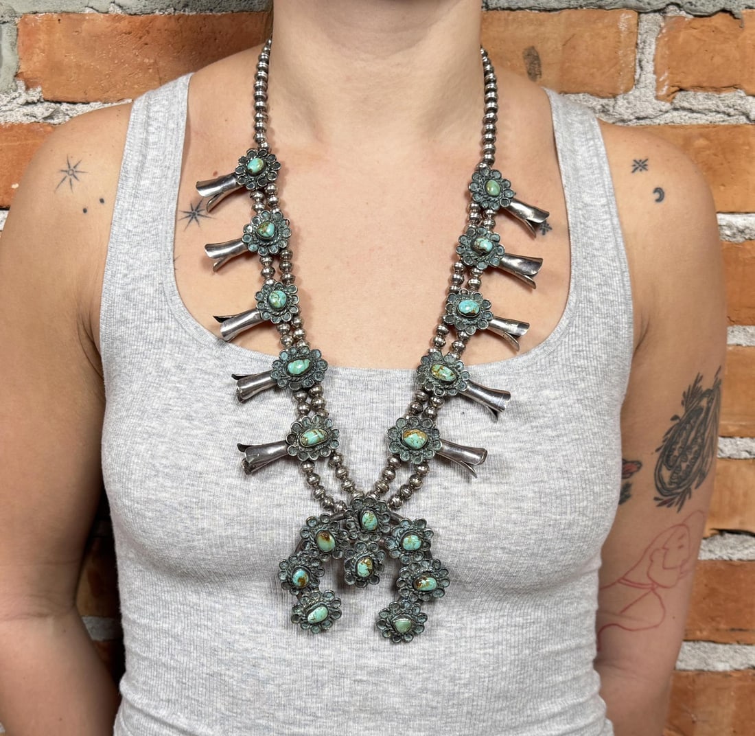 Navajo Sterling Silver Turquoise Squash Blossom: 197 grams. 16 3/8" long as displayed.