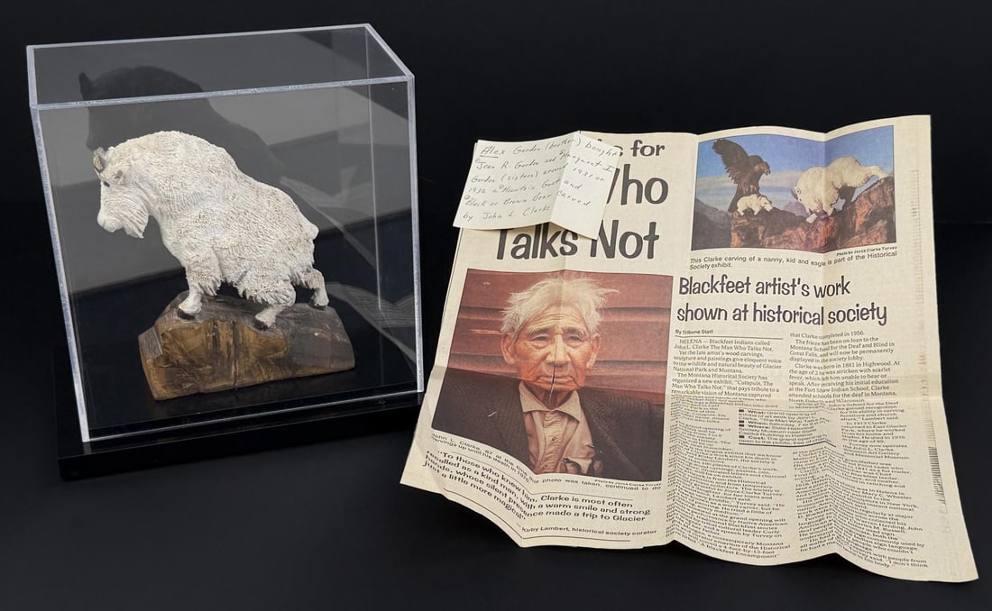 John Louis Clarke JL Clarke Mountain Goat Carving: Measures 5 3/8" by 4 3/4" by 1 7/8". Signed JLC, Xmas 1920. John Louis (Cutapuis) Clarke (1881 - 1970) was active/lived in Montana, Wisconsin. John Clarke is known for Wildlife wood carving-panels, In