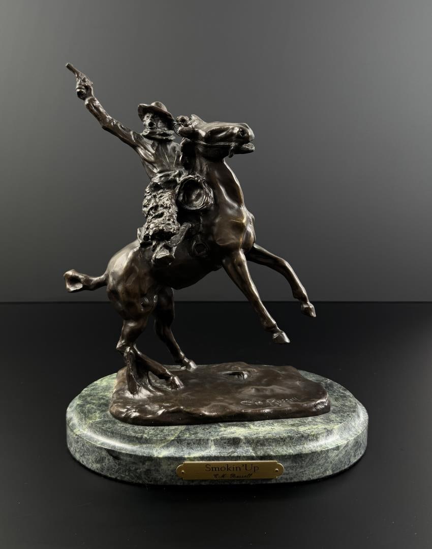 Charles M Russell Bronze Smokin Up: Title is Smokin Up. 12" by 10" by 7". Charles Marion Russell (1864 - 1926) was active/lived in Montana, California, Missouri. Charles Russell is known for Indian-frontier genre painting, sculpture.