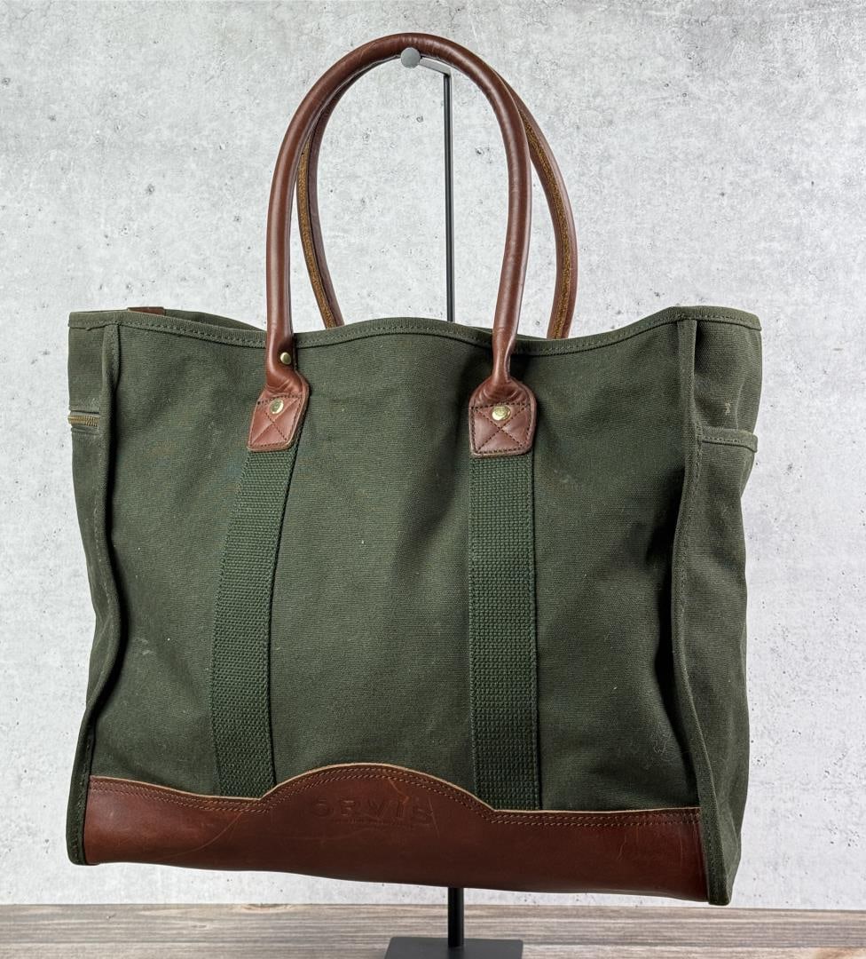 Vintage Orvis Canvas and Leather Tote Bag: 19 1/2" by 12 3/8" by 13 7/8" without handles.