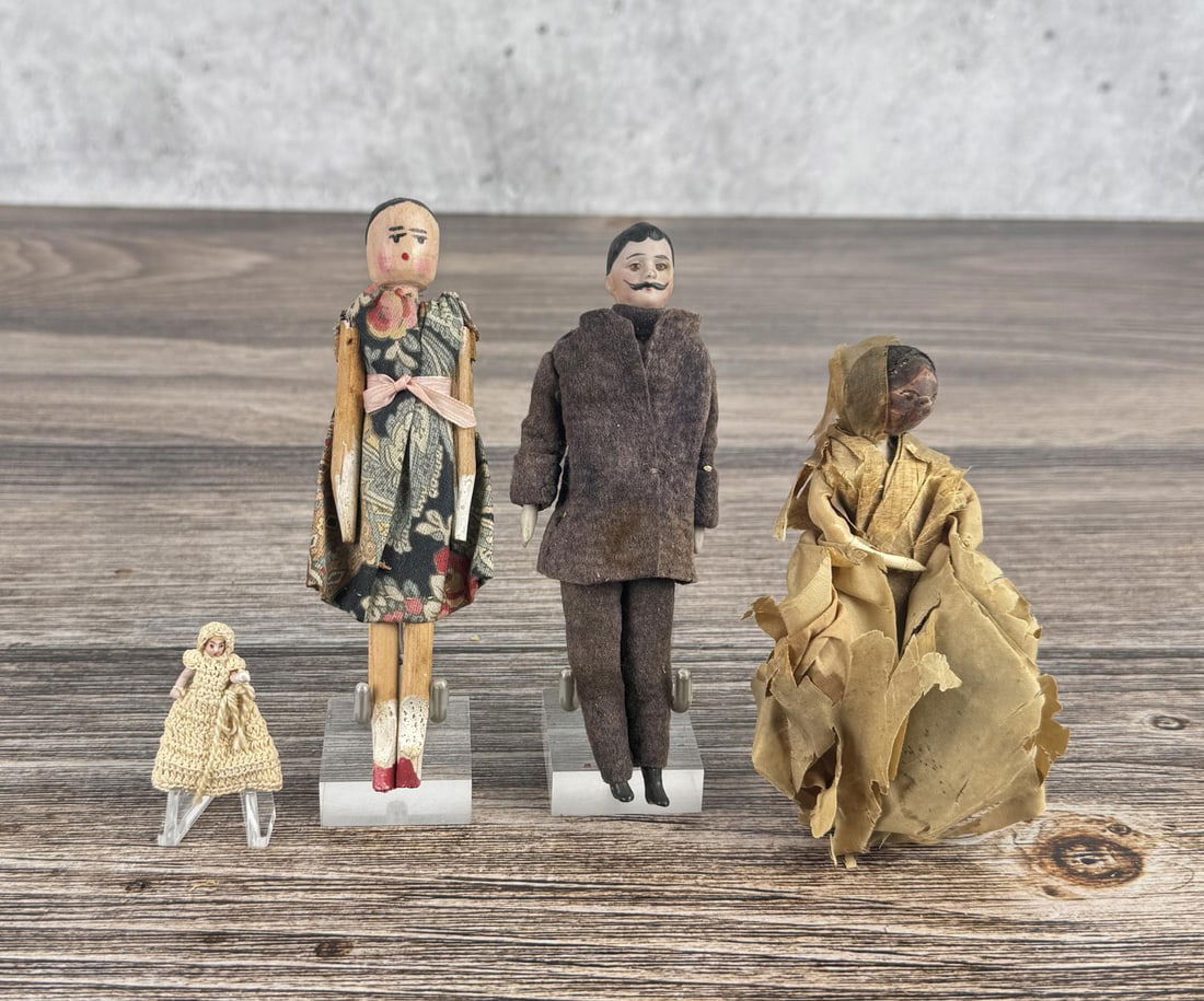 Group of German Porcelain and Wood Dolls: Peg doll, German man, lady and child doll. Man is 6" tall.