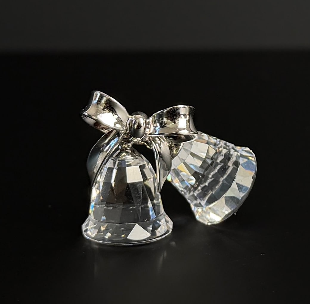 Swarovski Crystal Classic Bells Ornament: 1 1/4" wide, 1" tall. Rhodium plated metal accents.