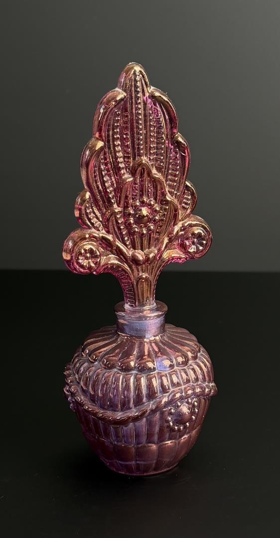 Pink Iridescent Carnival Glass Perfume Bottle: 7 1/4" by 2 7/8" by 2 7/8".