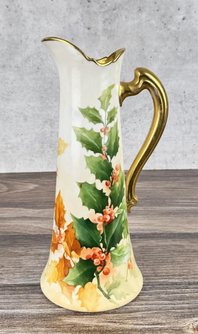 Limoges France Hand Painted Porcelain Pitcher Ewer: 13 7/8" by 6 1/4" by 5 7/8". Hand-painted holly leaves, berries, and gold trim.