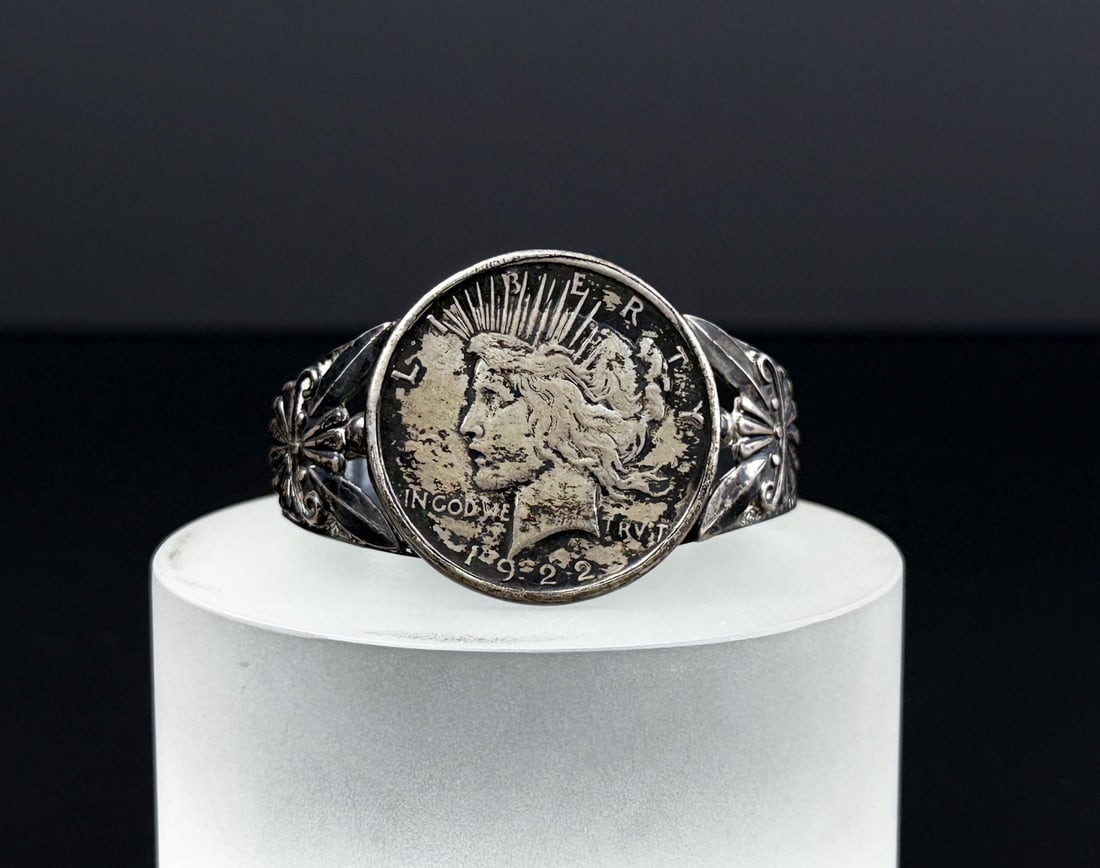 Navajo Sterling Peace Dollar Bracelet: 54.4 grams. 6" inner circumference.