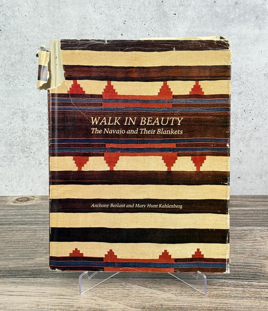 Walk in Beauty The Navajo and Their Blankets: Anthony Berlant and Mary Hunt Kahlenberg, 1977. First Edition. Some tears and weathering to the dust jacket. From the Native American reference library of Stanley Miller.