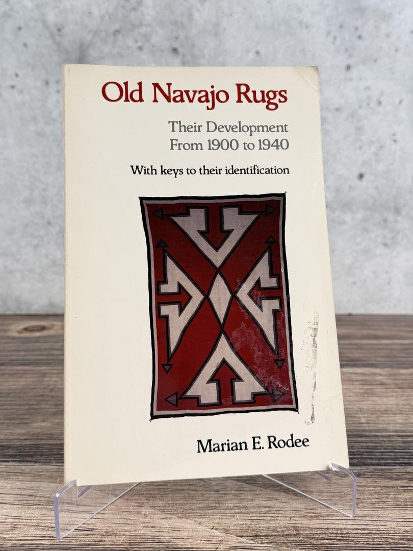 Old Navajo Rugs: Their Development From 1900 to 1940. Marian E. Rodee, 1981. From the Native American reference library of Stanley Miller.