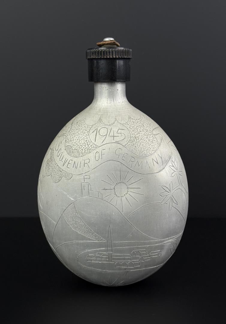 WW2 German 1945 Trench Art Canteen: 8 1/4" by 5 1/4" by 2 7/8". Back reads Scotland and England to Middle East with United States ? France ? Belgium ? Luxembourg ? Holland.