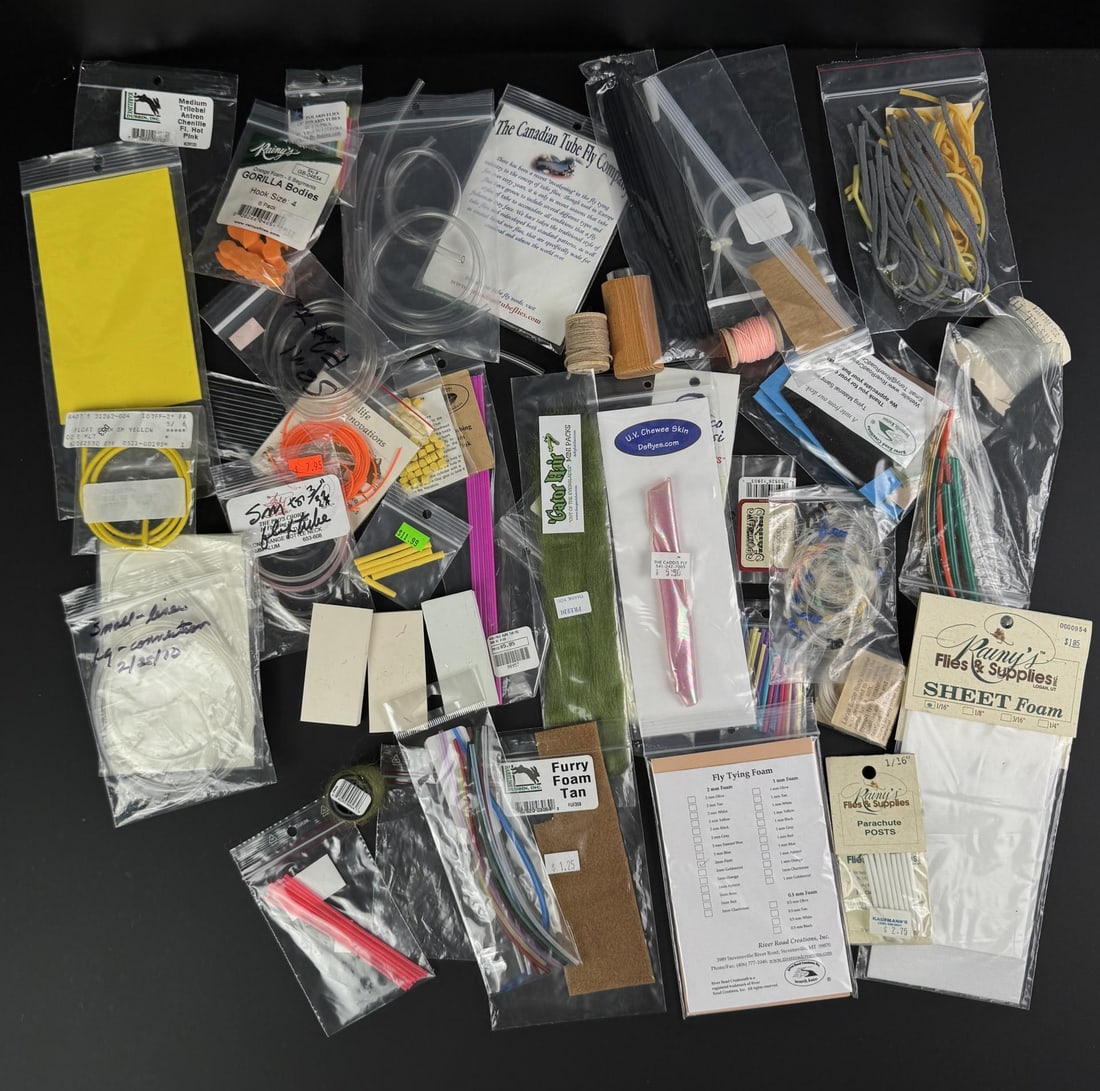 Group of Tube Flies Fly Tying Materials: Materials include chenille, foam sheets, synthetic hair, and specialized tubes for construction. Brands represented include Rainy's Flies & Supplies and The Canadian Tube Fly Company.