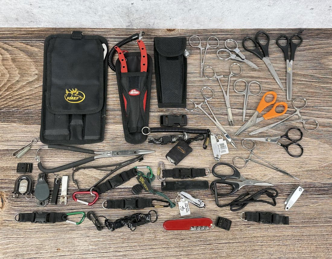 Fly Fishing Tools and Accessories: Includes a Berkley fishing tool set with retractable lanyard, and a variety of precision cutting tools.