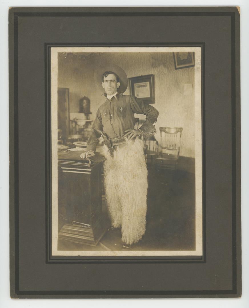 Armed Cowboy in Wooly Chaps Cabinet Photo (1 of 3)