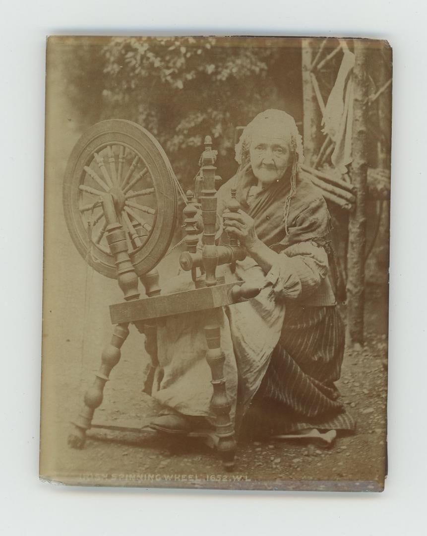 Old Woman with Irish Spinning Wheel Cabinet Photo (1 of 3)