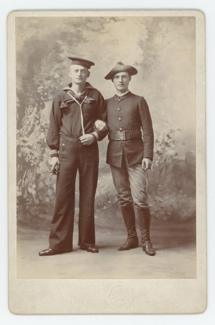 Spanish American War Soldiers Cabinet Photo: Soldier is wearing an unusual Mills Buckle. Sailor and Infantry man smoking. Double sided cabinet with man and woman wedding day reverse. Card is by Teuber, Chicago Illinois.