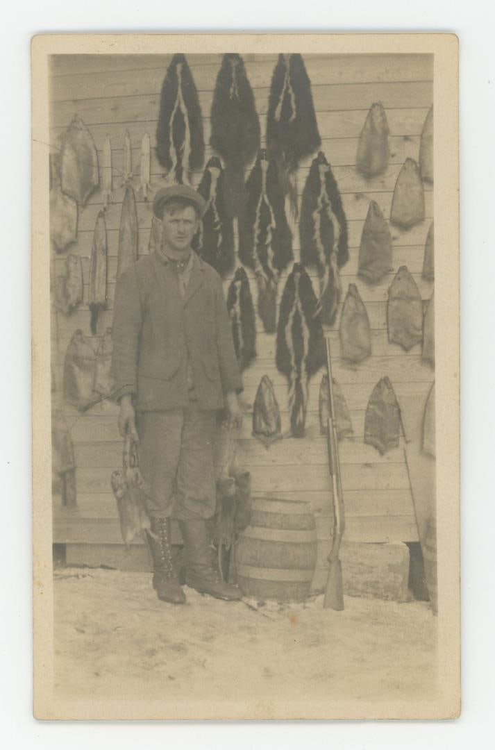 Skunk and Muskrat Trapper Trapping RPPC Postcard: Nice image.
