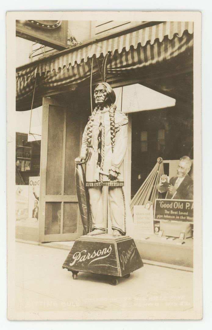 Sitting Bull Cigar Store Indian RPPC Postcard: Ashland Wisconsin.