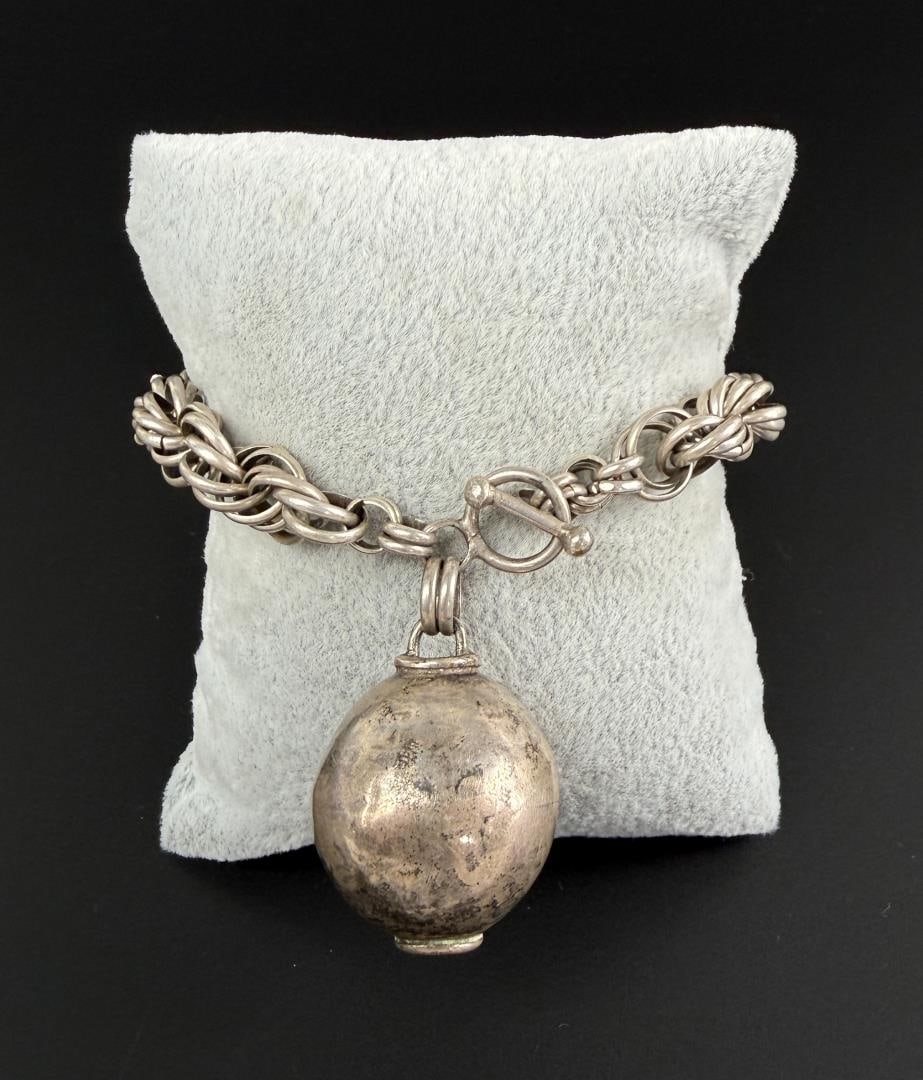 Sterling Silver Ball Charm Bracelet: 6 3/4" inner circumference. 37.79 grams.