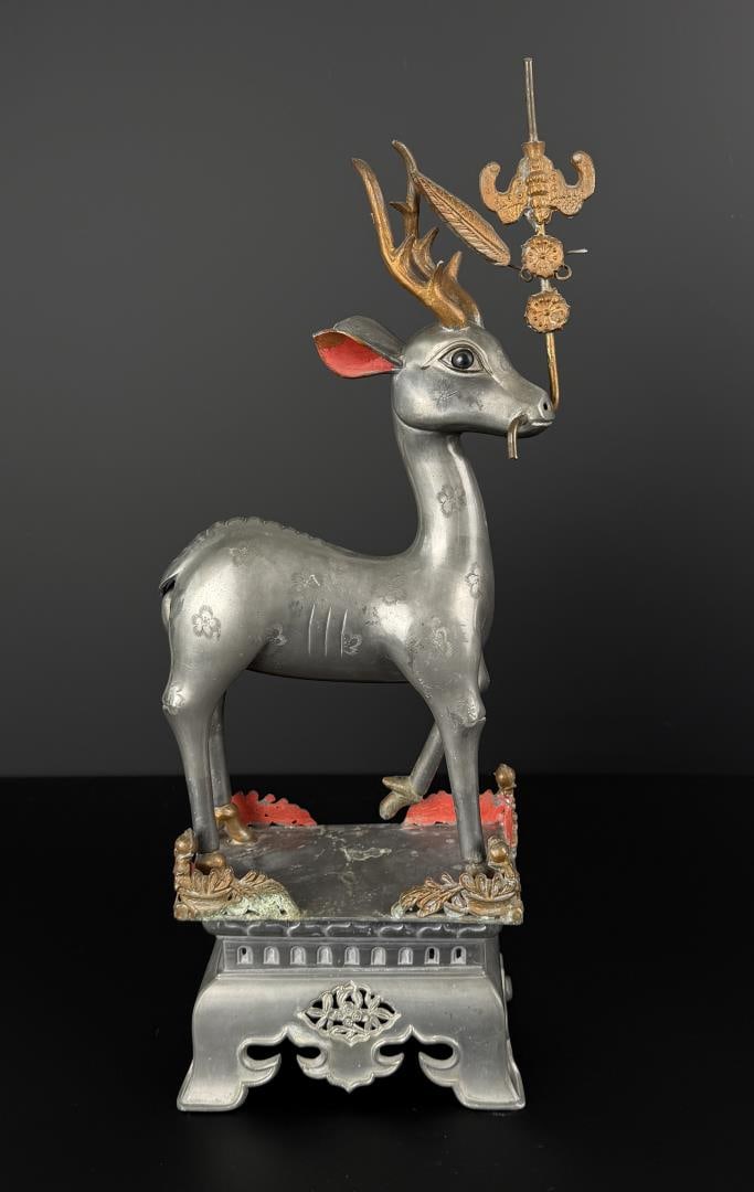Chinese Pewter Deer Candlestick: 17 7/8" by 7 7/8" by 4". Marking translates: Made by Dong Chang Hao. Small oval translates: spot copper. This is missing the candle tray.