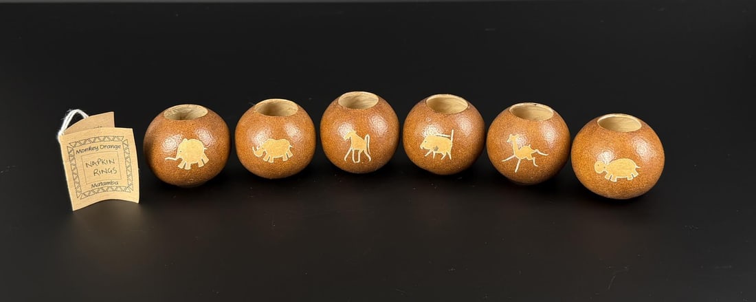Matamba Monkey Orange Napkin Rings: 2 1/4" by 2 1/4" by 1 7/8" each. Rings are made from a Monkey Orange tree, or the Matamba, in Africa.