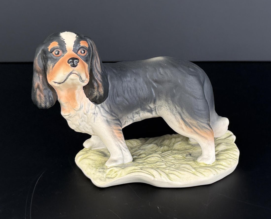 Goebel Bisque King Charles Spaniel Figurine: 5 1/4" by 3 7/8" by 2 7/8". Model number 30200.