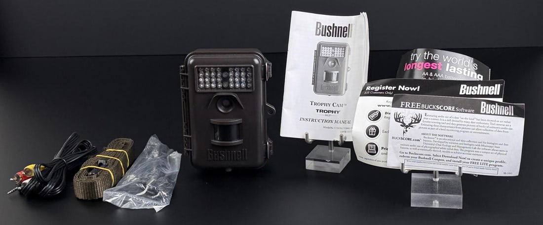 Bushnell Trophy Cam XLT Trail Game Camera: Sold with accompanying cords, instruction manual and a memory card. Turns on.