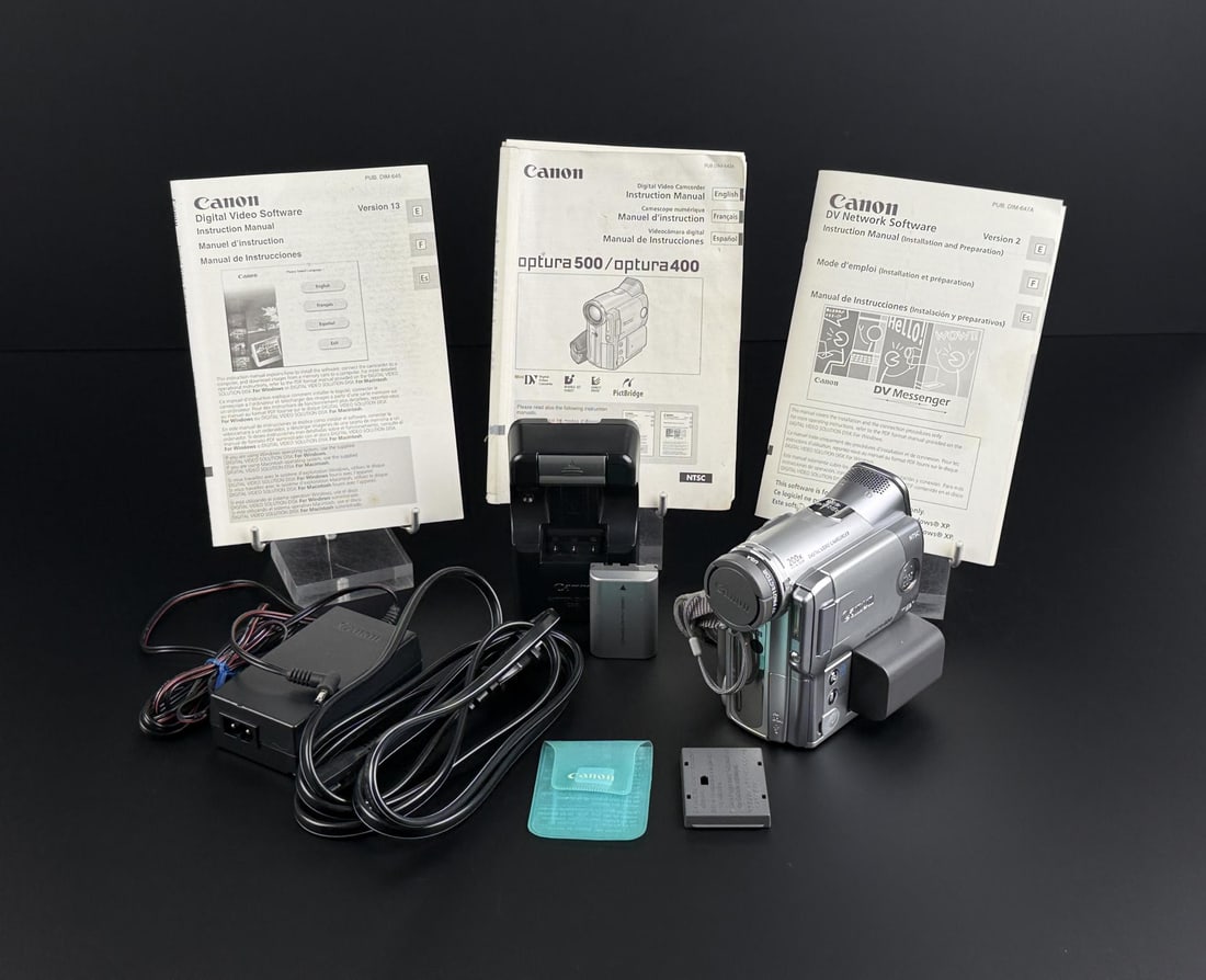 Canon Optura 400 Digital Video Camcorder: Sold with accompanying cords and instruction manuals. In working condition.