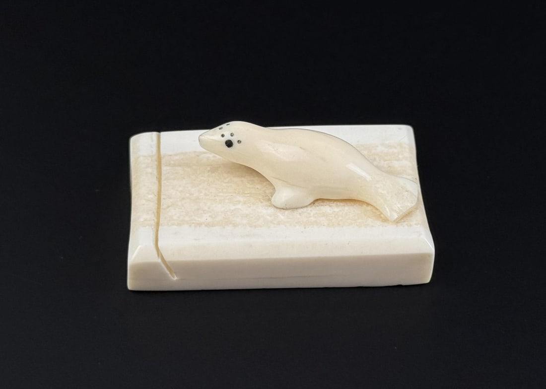 Alaskan Inuit Ivory Carved Seal Letter Stand: 2 3/8" by 1 1/2" by 3/4". Native made prior to 1972. This item cannot be shipped to Oregon, California, Hawaii, New York, New Jersey, Internationally, or any other state that prohibits.