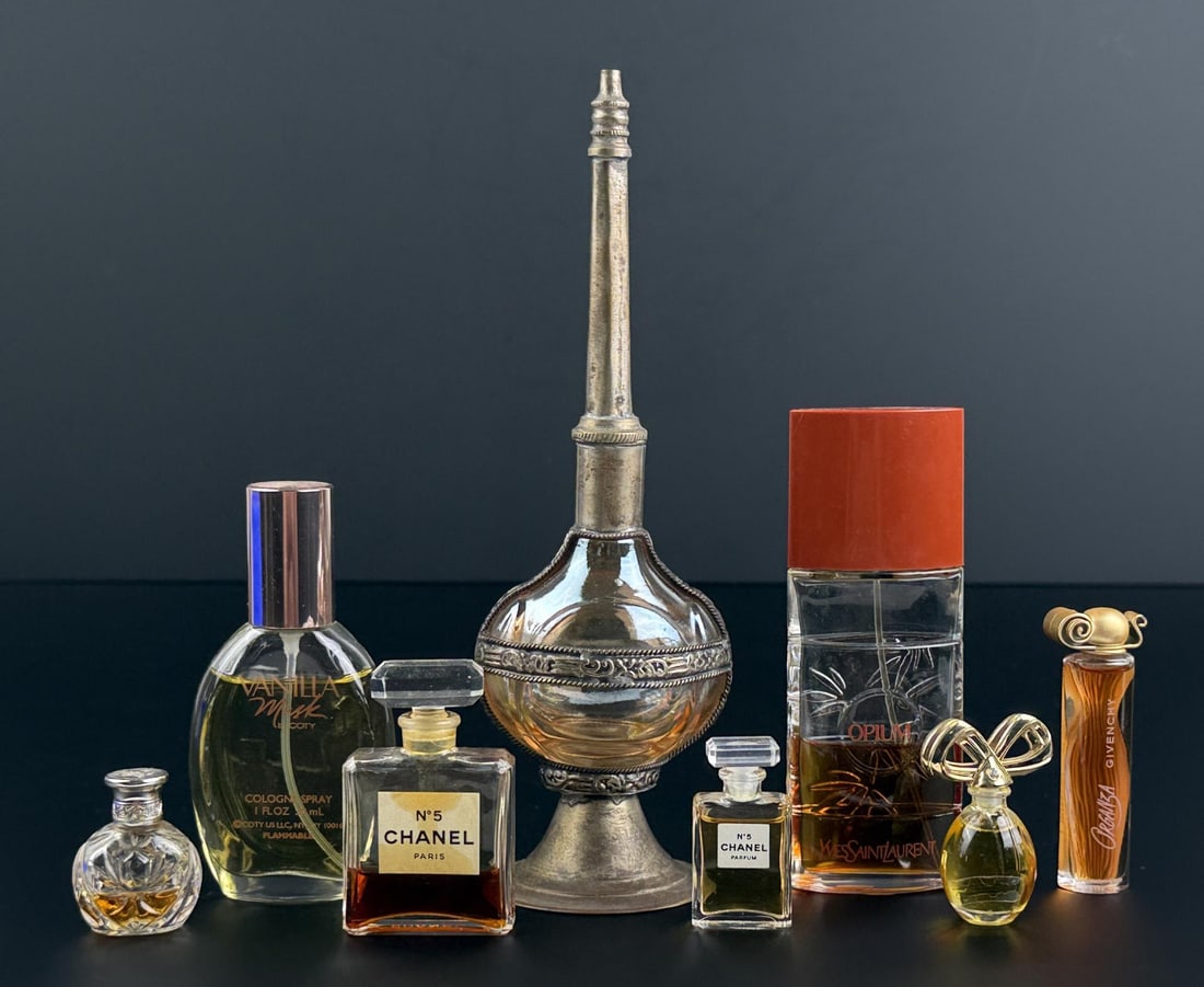 Collection of Vintage Designer Perfume Bottles: Includes products by Yves Saint Laurent, Givenchy, Chanel Number 5, and more. The Orchidee bottle is empty.