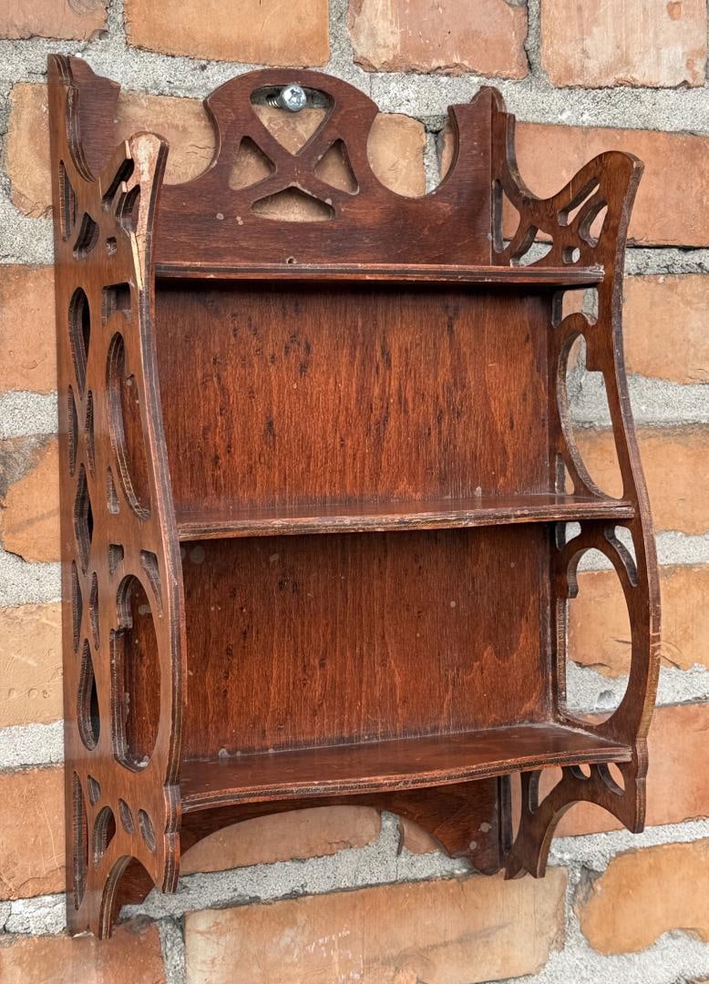 Mid Century Nutone Fretwork Hanging Wall Shelf: 15 3/8" by 8 7/8" by 5 1/2". Some damage to one of the wood panels as shown.