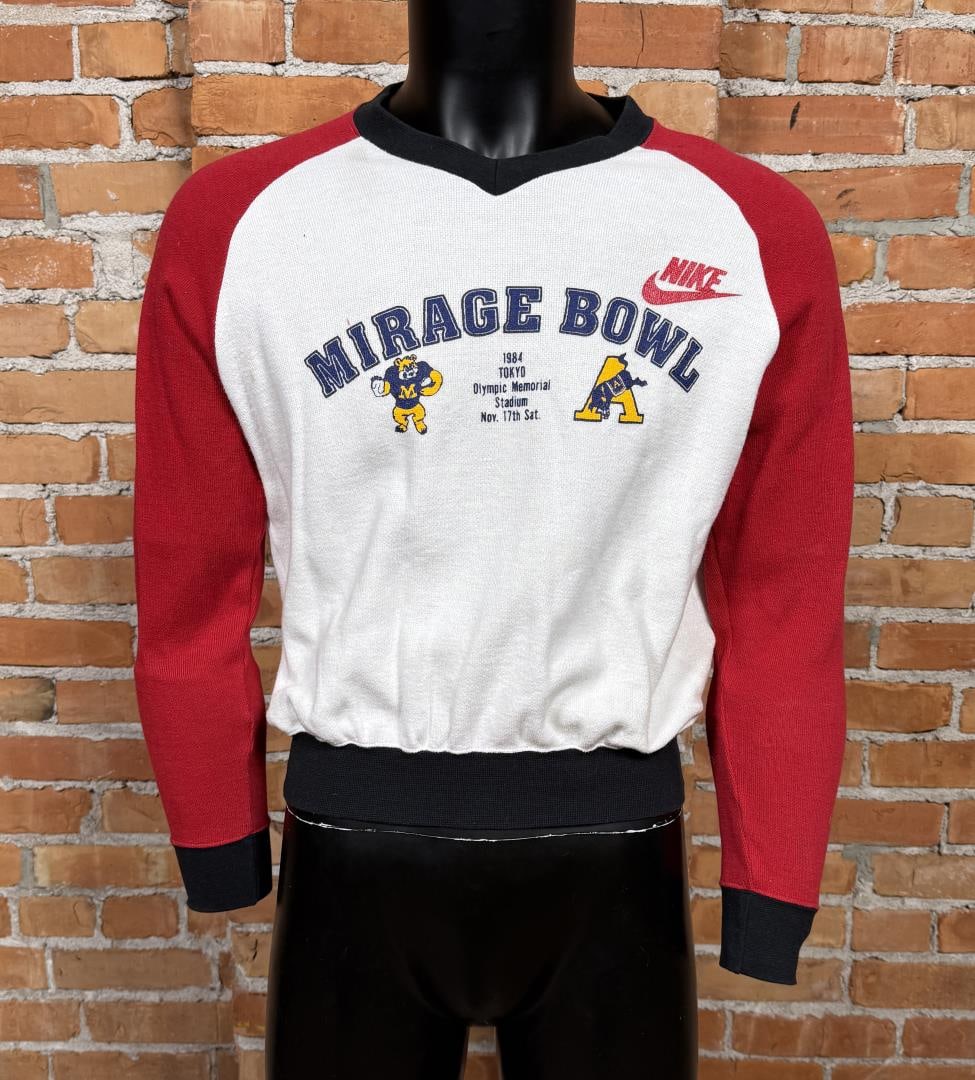 Vintage Nike Mirage Bowl 1984 Sweatshirt: Size Medium. The 1984 Mirage Bowl was an American college football game played on November 17, 1984, at Tokyo's Olympic National Stadium, where the Army Cadets defeated the Montana Grizzlies 45-31. Ar