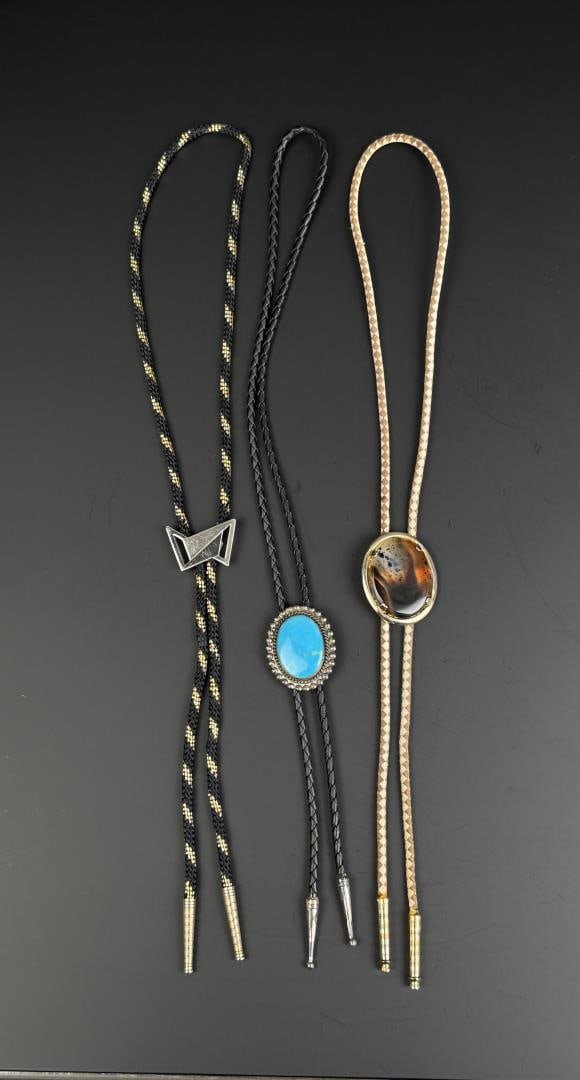 Collection of Navajo Bolo Ties: Nice Navajo Pacific Jewelry Sterling and Turquoise center bolo, Montana Agate bolo on the right. Pacific Jewelry bolo weighs 24.19 grams of sterling silver.