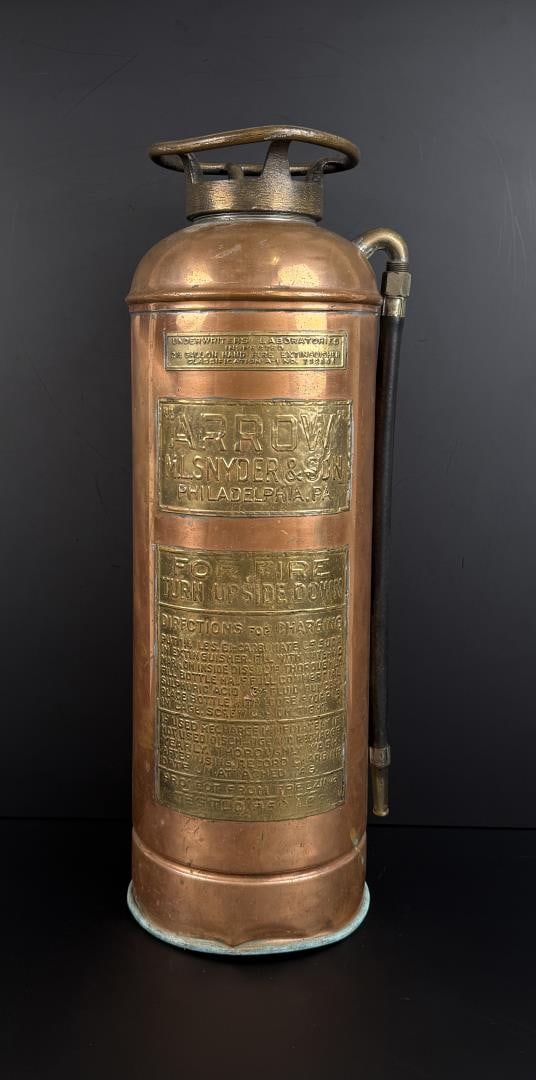 Arrow Copper Fire Extinguisher: 7 3/8" by 22 3/8" tall.