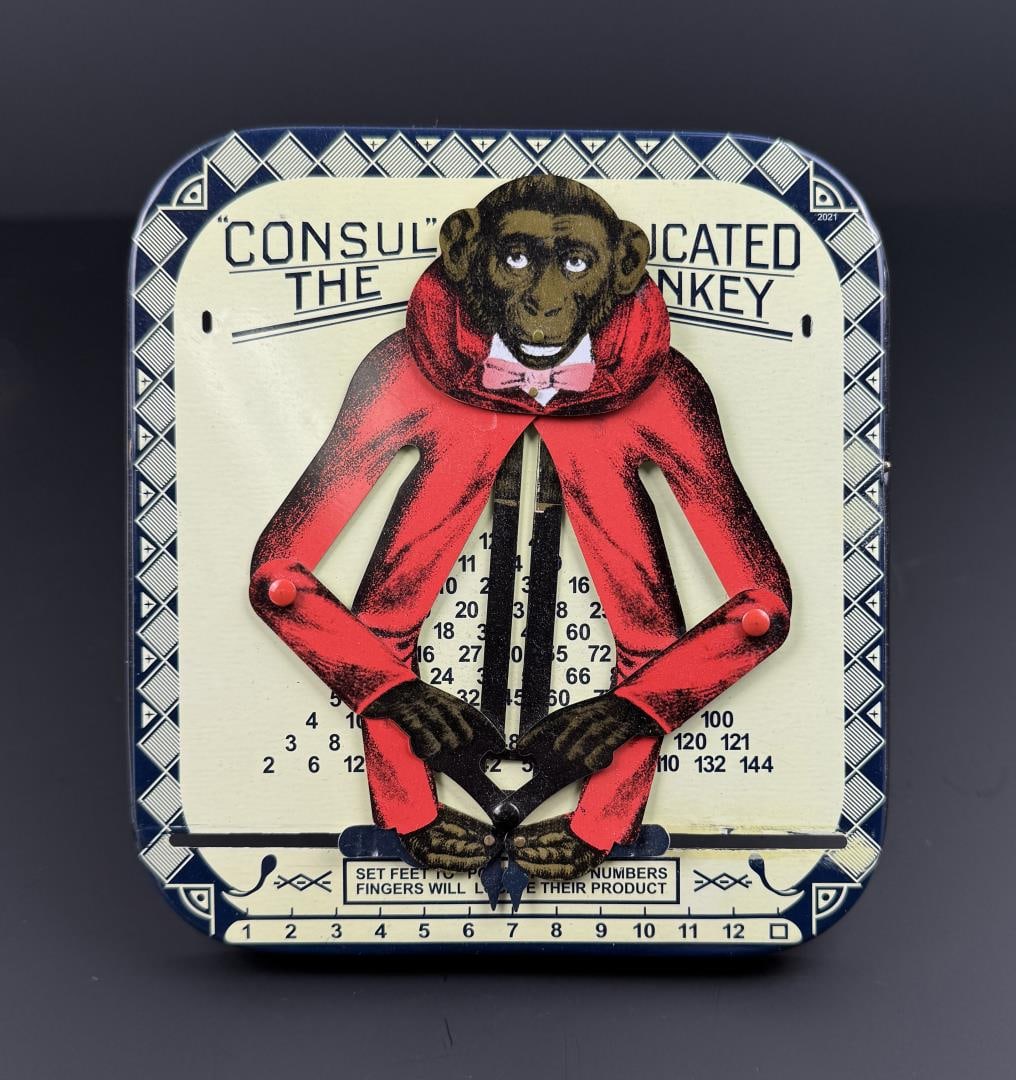 Educated Monkey Tin Litho Toy Calculator: 5 1/2" by 6 3/8".