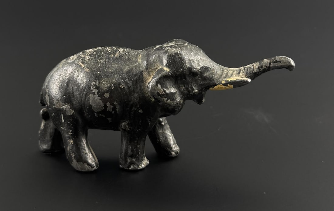 Cast Iron Bull Elephant Paperweight: 3 1/2" by 1 5/8" by 1 1/8".