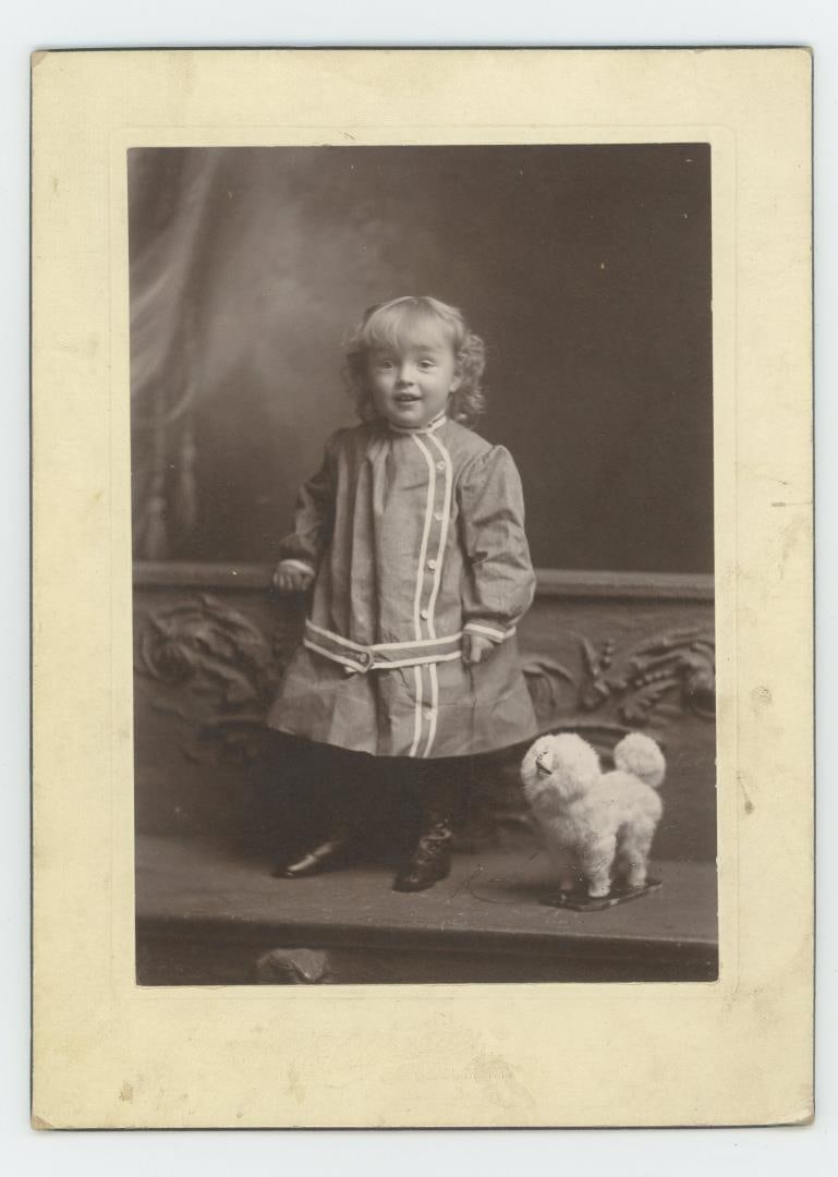 Child with Pull Toy Dog Cabinet Photo (1 of 3)