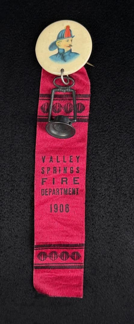 1906 Valley Springs Fire Department Ribbon: Valley Springs California. Button made by Bastian Brothers of New York, 6" long.