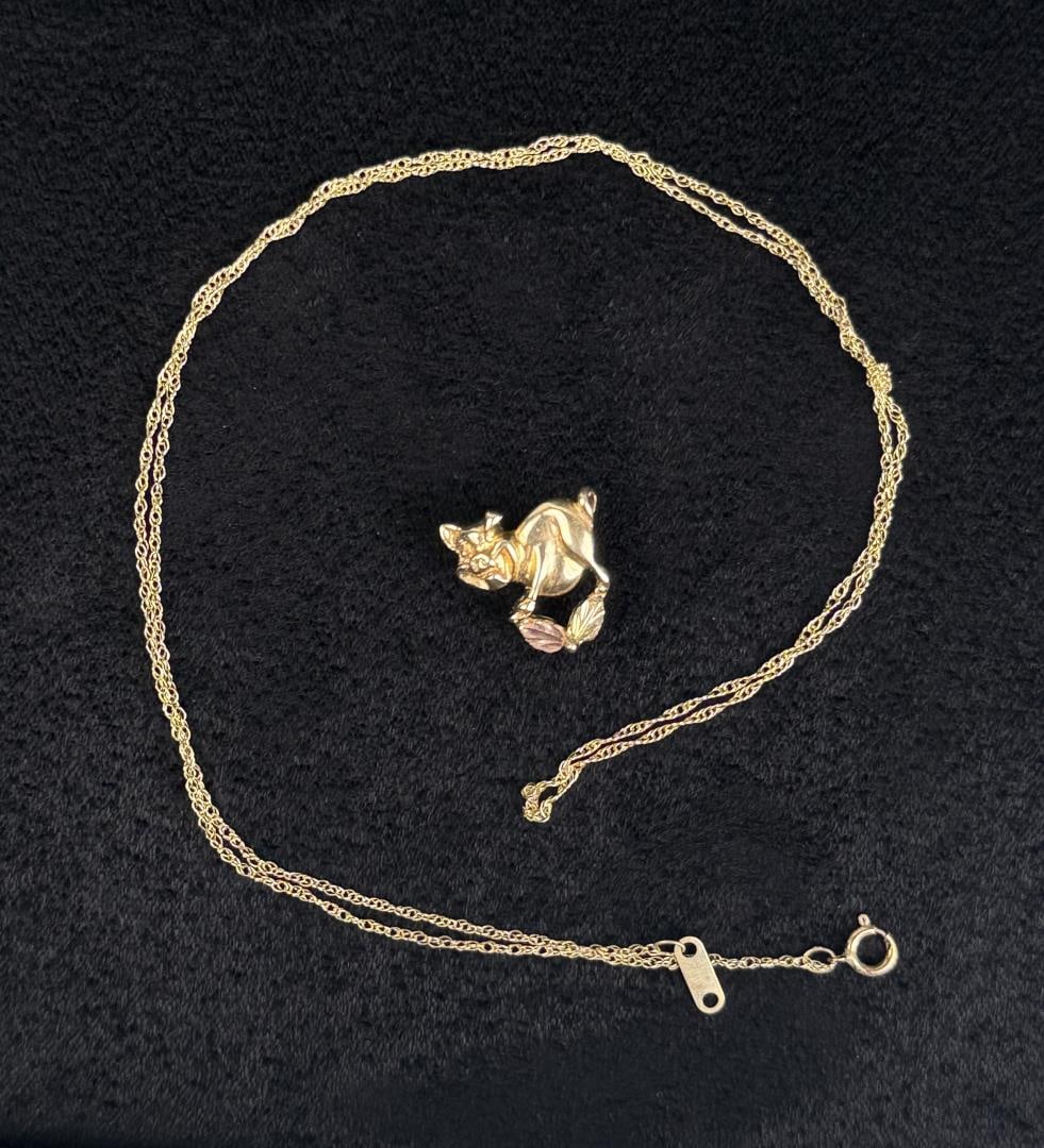 10k Gold Chain and Pig Pendant: 2.42 grams. Chain is knotted.