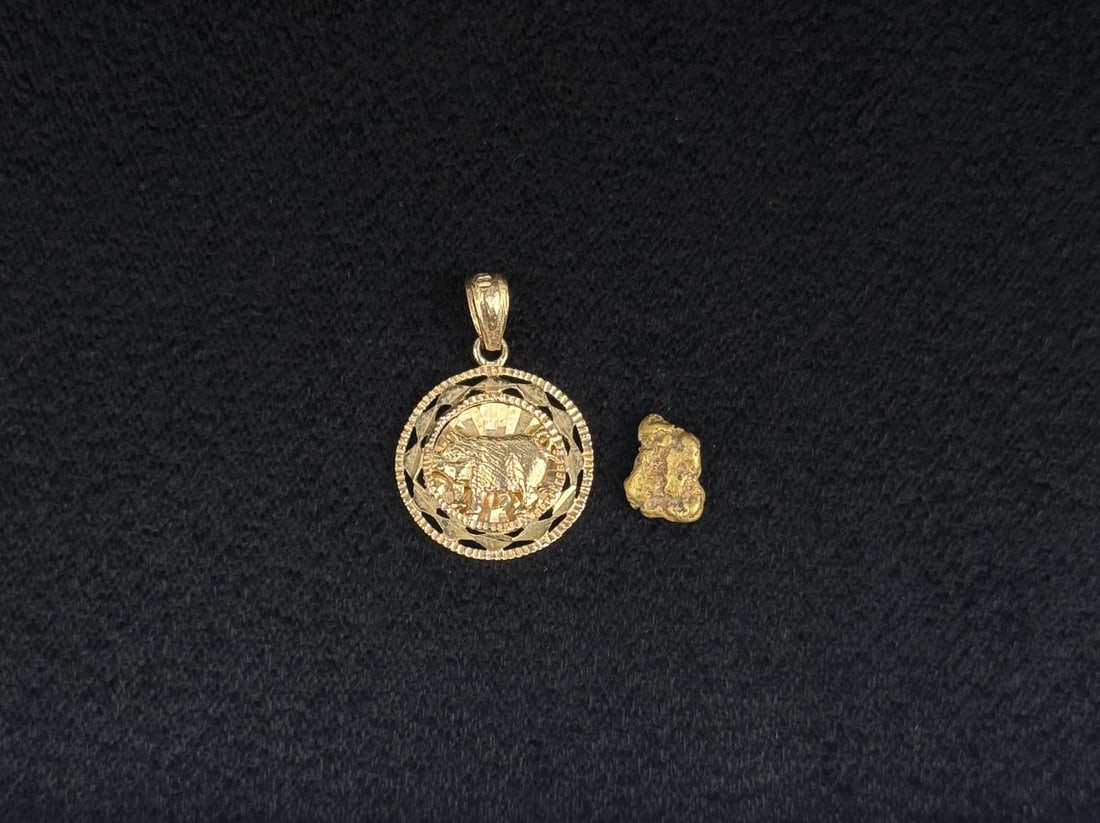 18k Gold Nugget and Pendant: 2.13 grams. Pendant is 3/4" long.