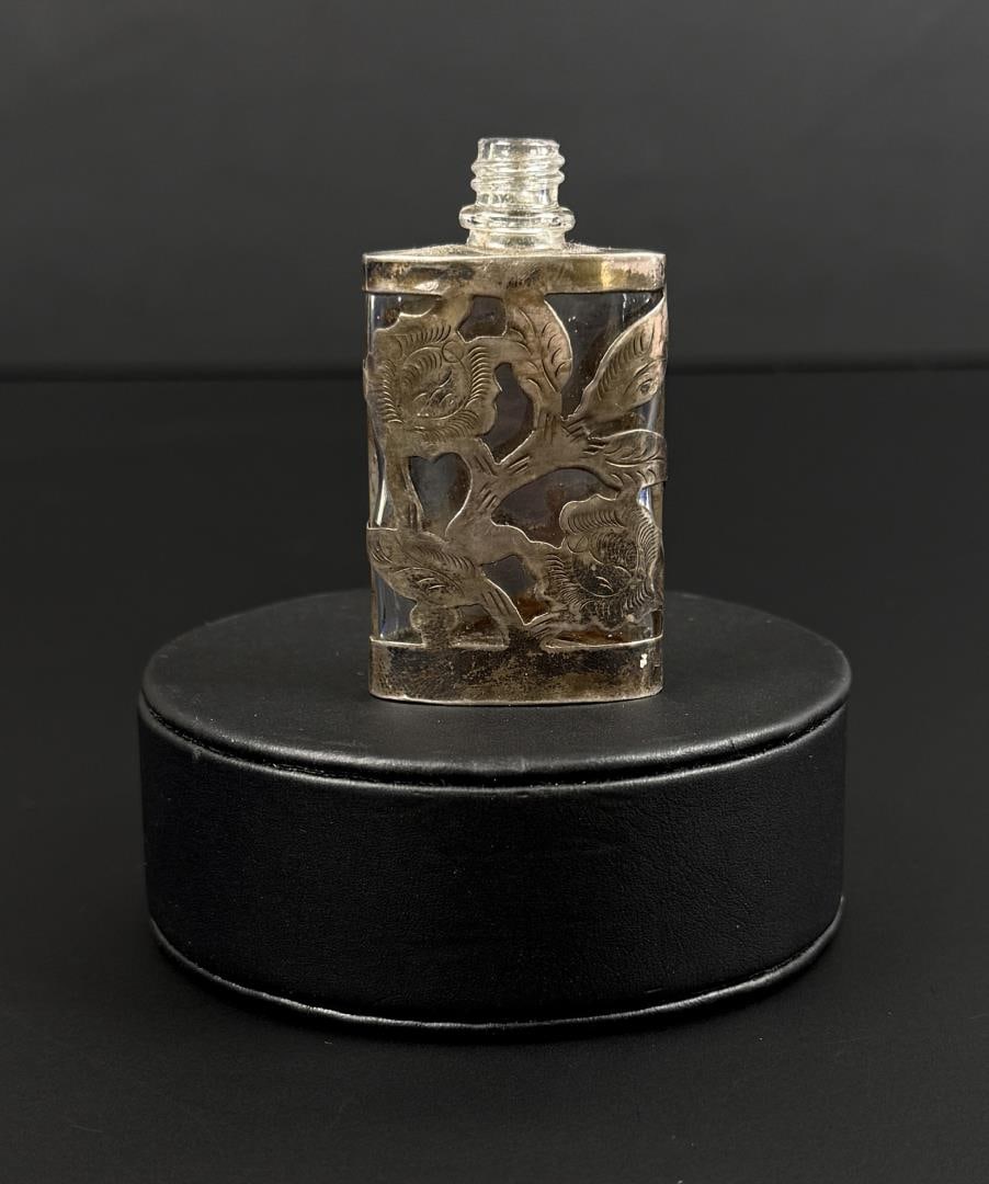 Sterling Silver Mexican Perfume Bottle: 2 1/4" by 1 1/4" by 1/2". 24.61 grams.