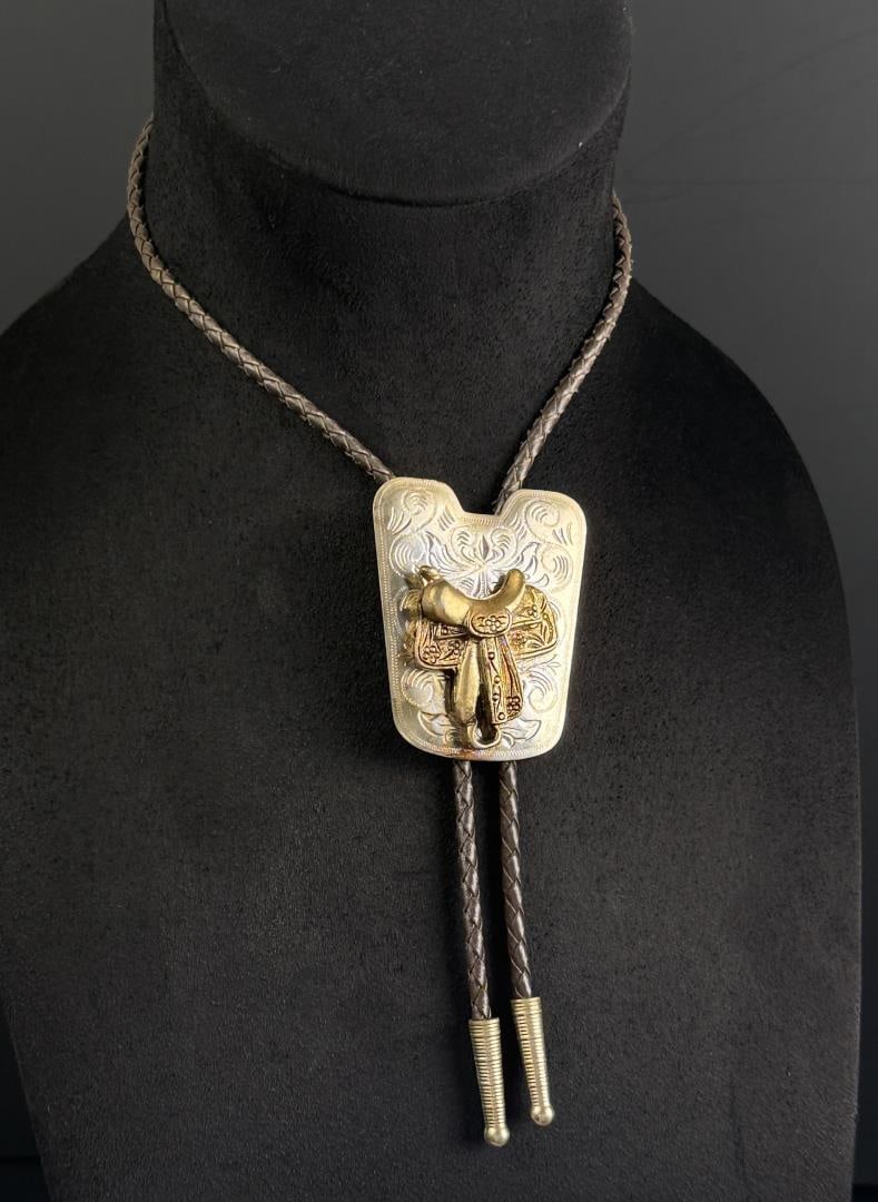 1950s Cowboy Western Saddle Bolo Tie: 17 7/8" long as displayed.