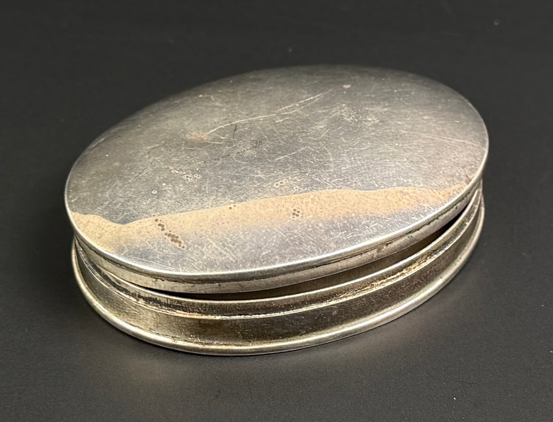 Sterling Silver Pill Box: 2 1/4" by 1 7/8" by 7/8". 31 grams.