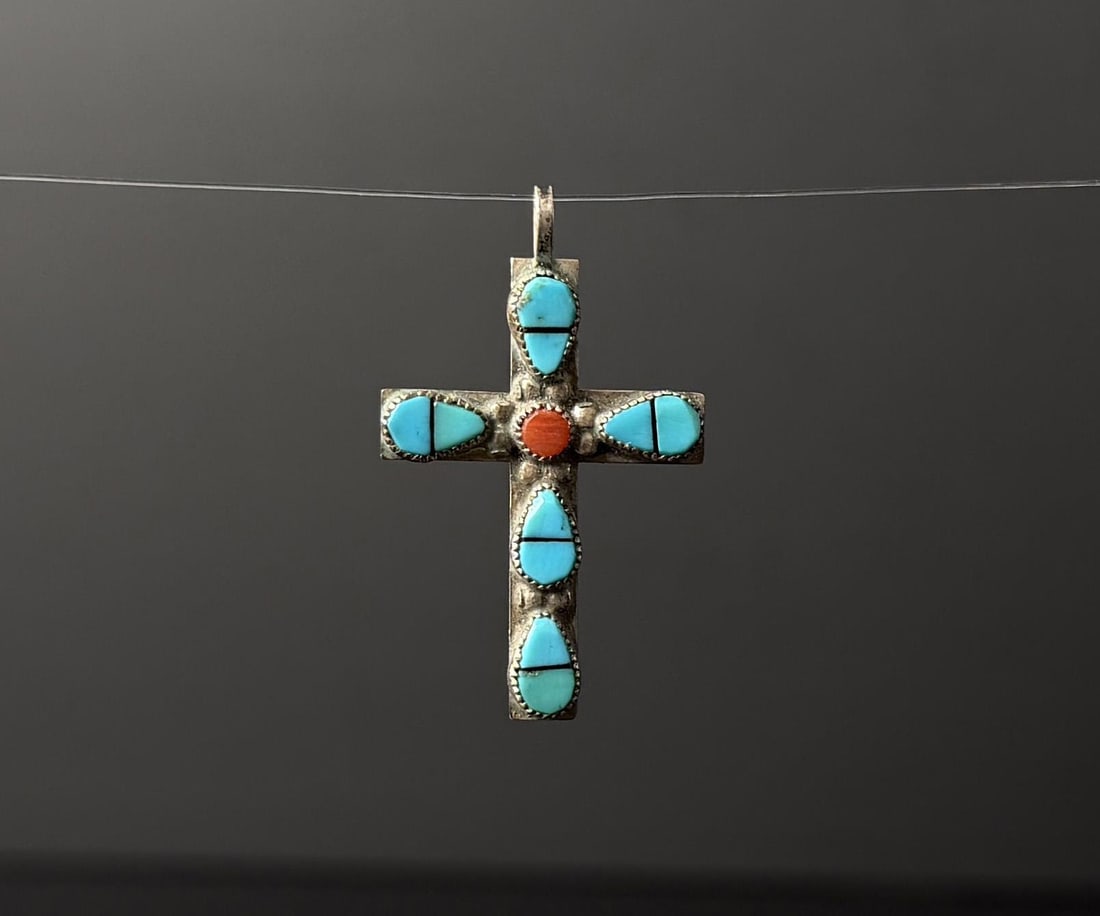 Zuni Sterling Silver Turquoise Cross Pendant: 1 1/4" by 7/8". 2 grams. Has turquoise and coral cabochons.