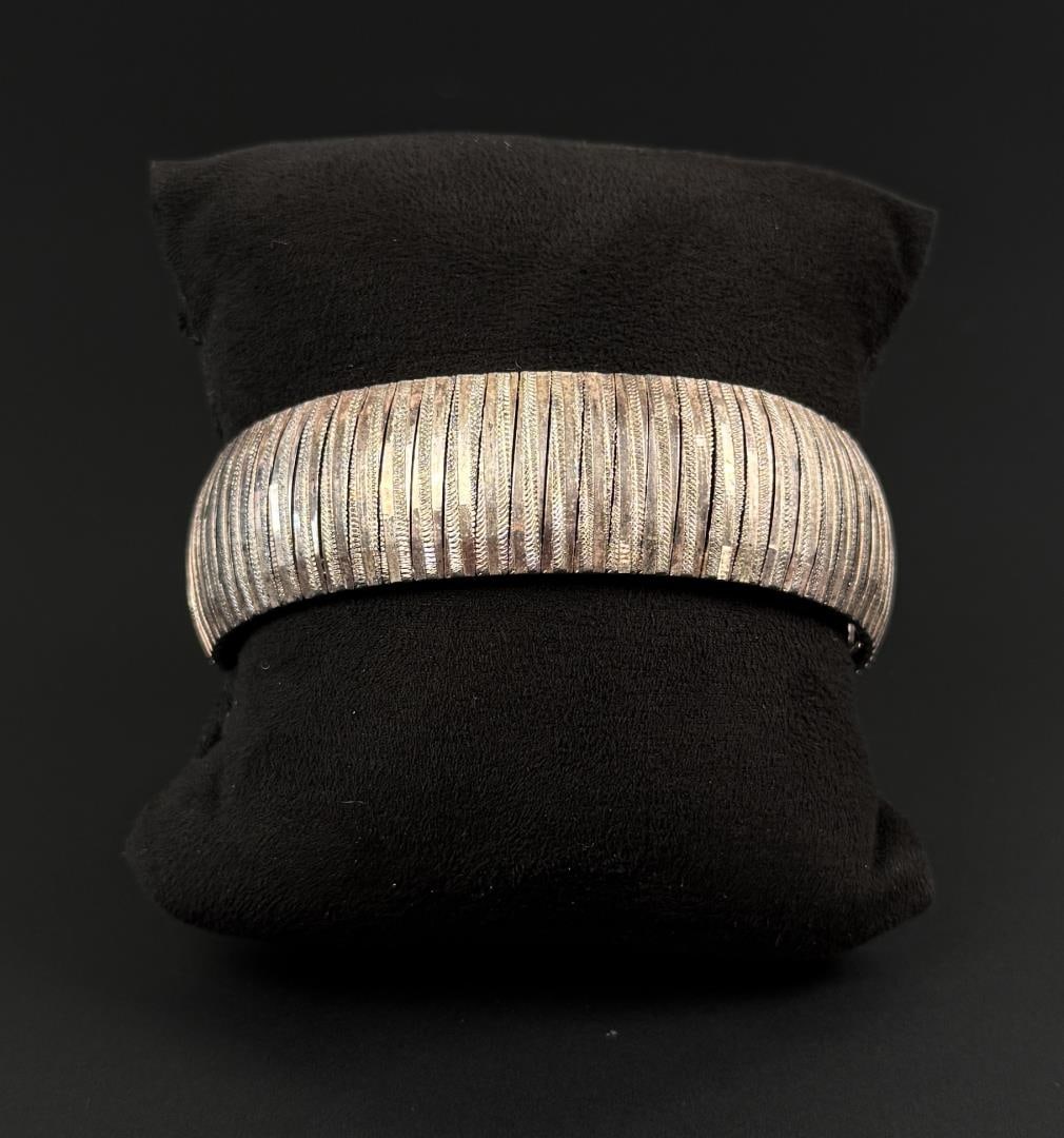 Sterling Silver Omega Link Bracelet: 6 3/4" inner circumference. 28.58 grams.